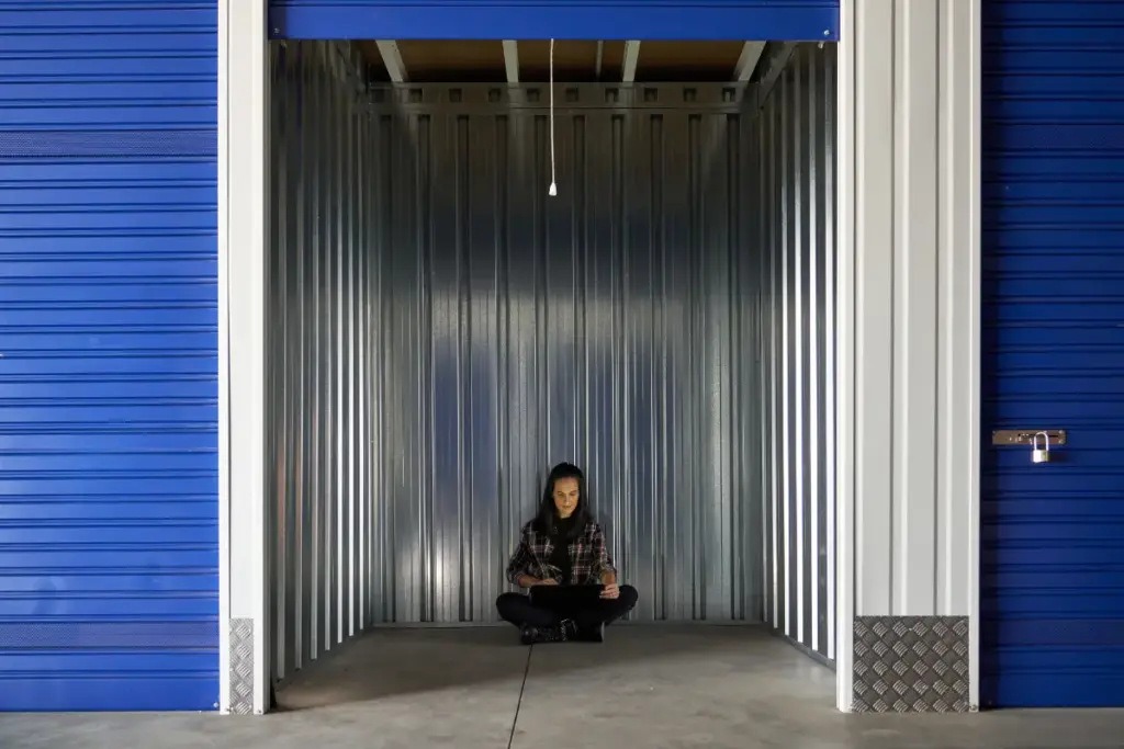 Woman in the opening of a self storage container